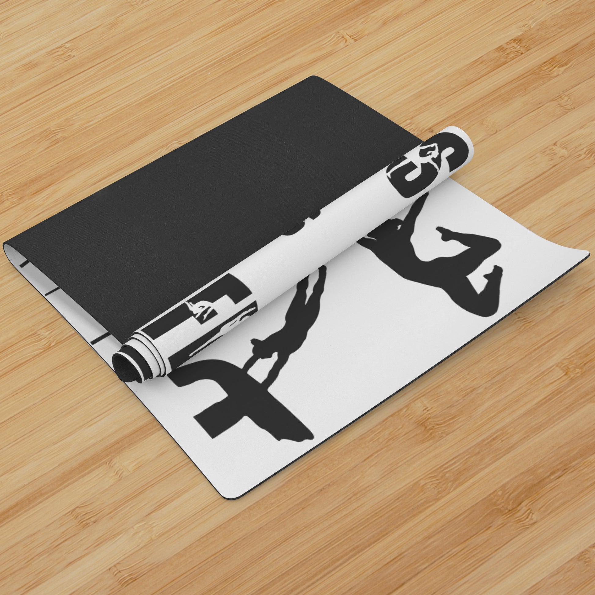 This Gymnastics is Life Yoga mat is white, and features black silhouettes of talented gymnasts across the front, along with the phrase "Gymnastics is Life" in a fun black gymnastics font