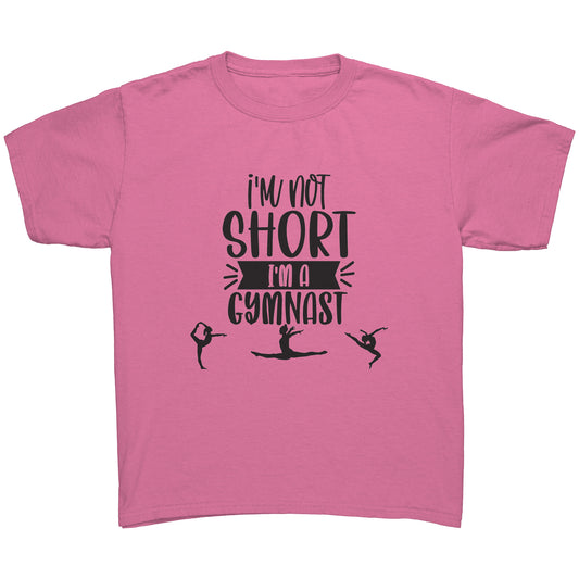 I'm not short I'm a gymnast Children's T-Shirt in azalea. This t-shirt says "I'm not short I'm a gymnast in black font and includes the silhouettes of gymnasts on the front.