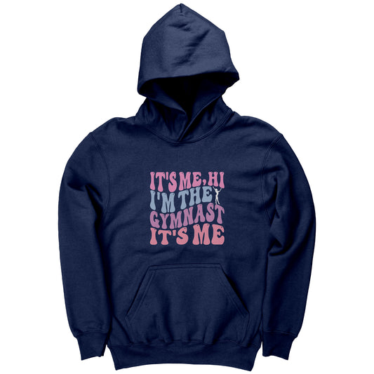 This navy hoodie features the catchy phrase "It's Me, Hi, I'm the Gymnast, It's Me" in a vibrant bubble font on the front, complemented by an elegant image of a gymnast striking a graceful pose.
