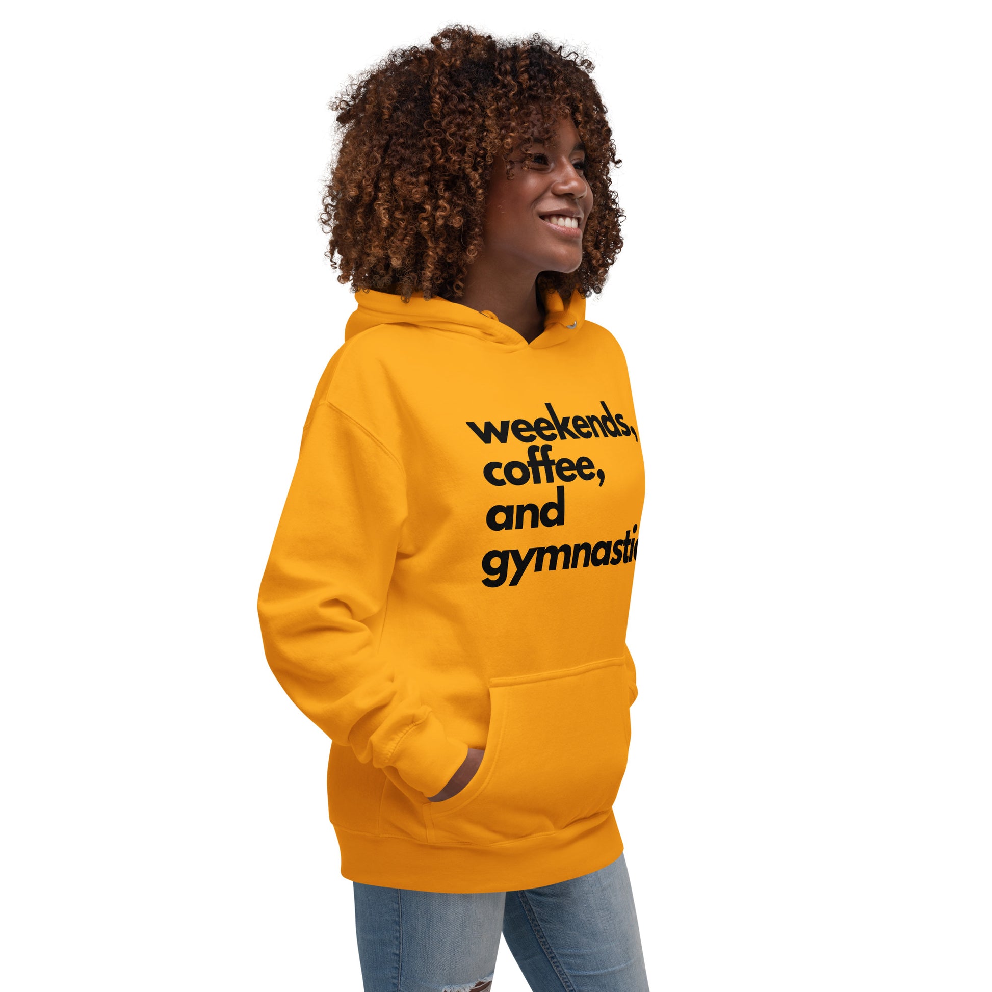 Gold parent hoodie with front graphic text, standing side view.