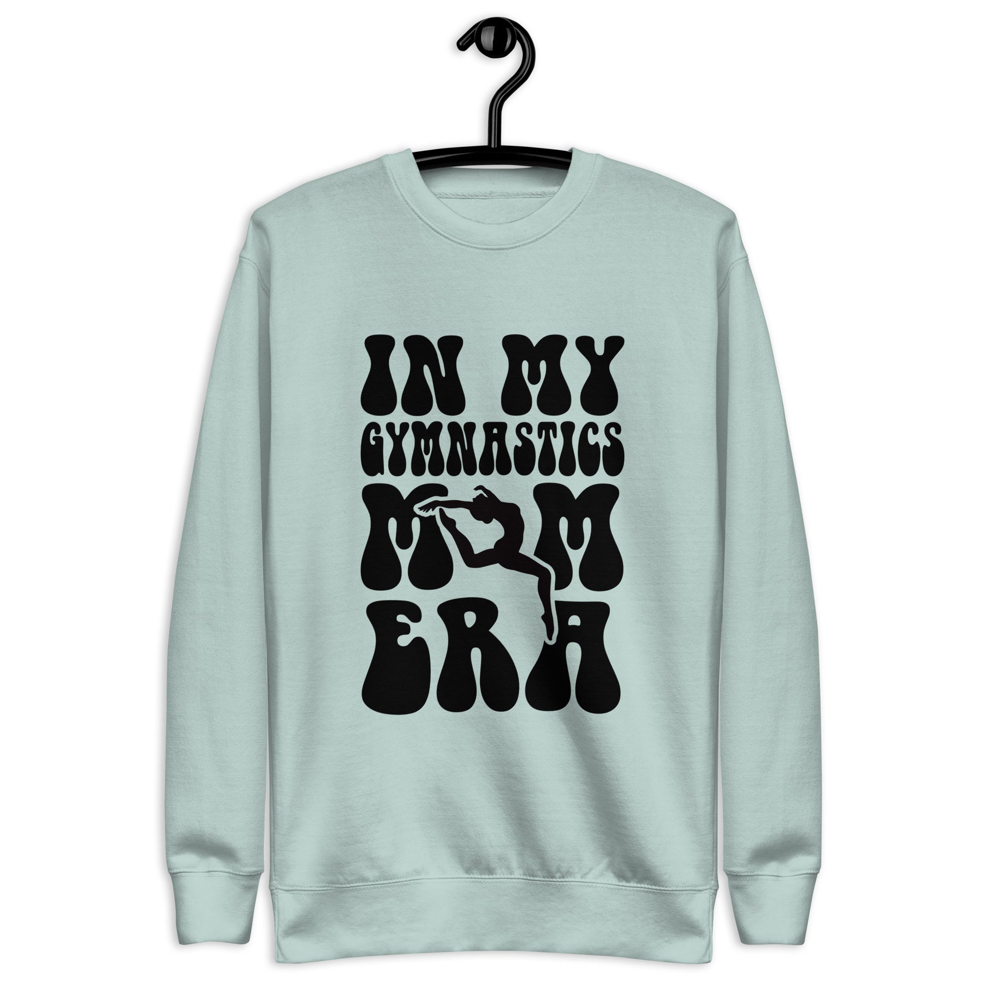 Light teal hoodie with “In my gymnastics” graphic text and stylized hands