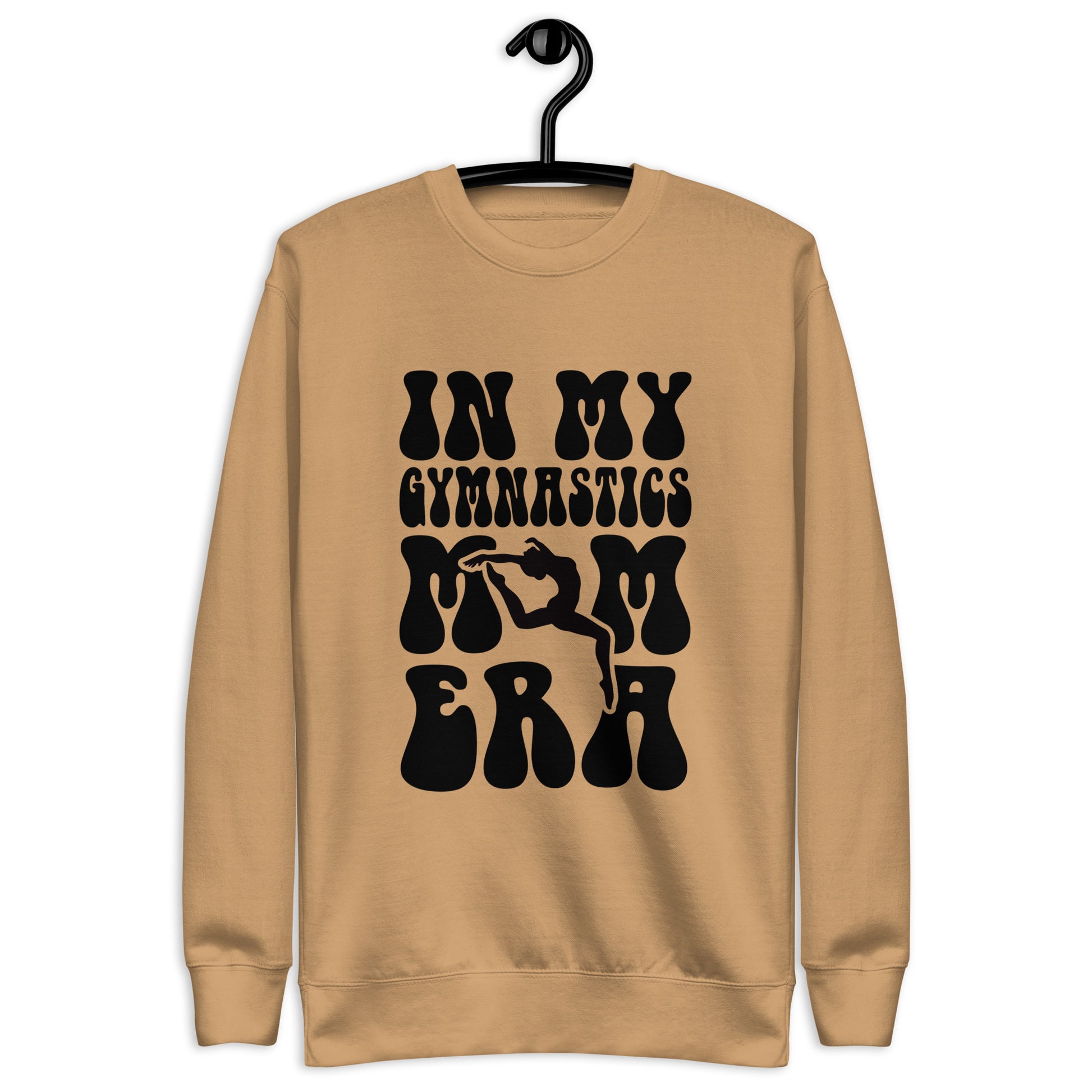 Tan hoodie with “In my gymnastics” graphic text and stylized hands