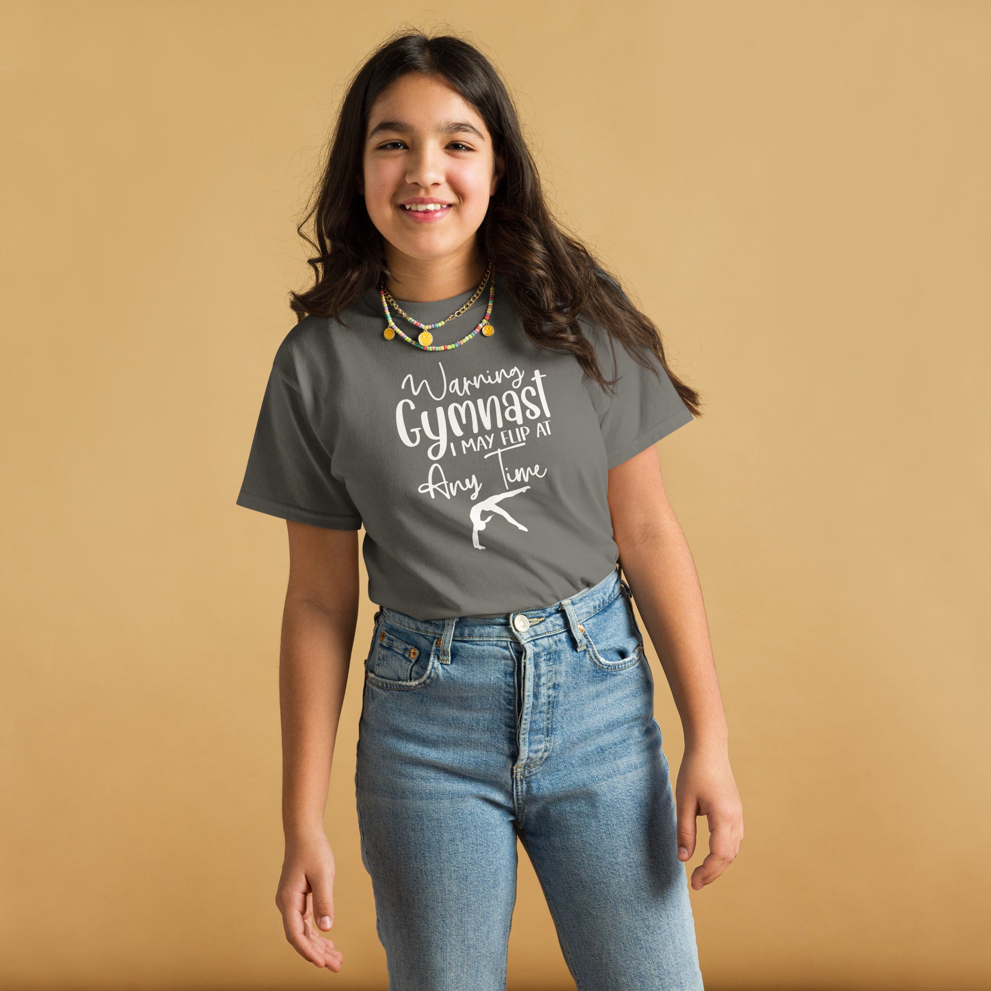 Gray kids gymnast T-shirt with white warning text and gymnast pose graphic on front
