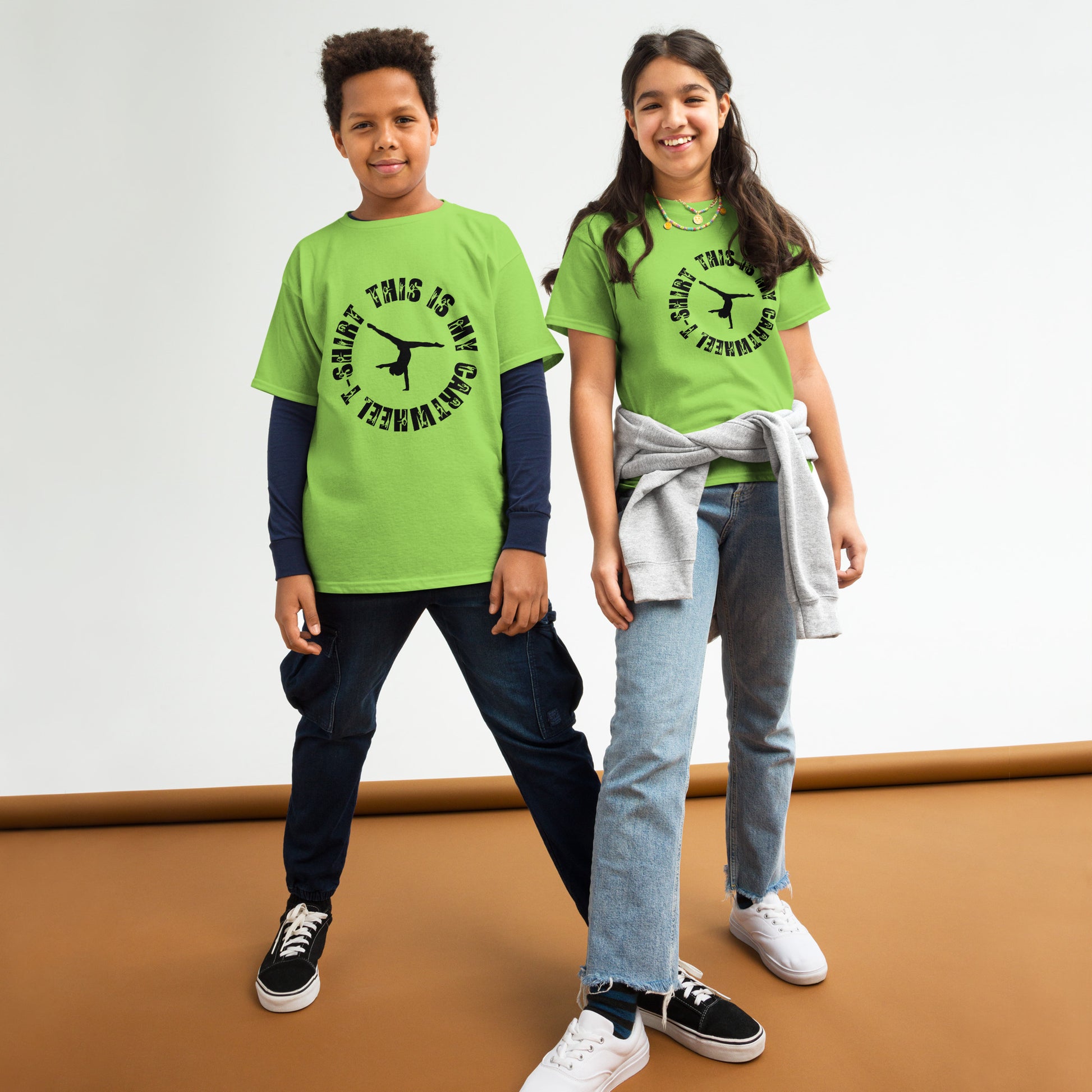 Kids gymnastics T-shirt in lime green with black gymnast graphic and ring text.