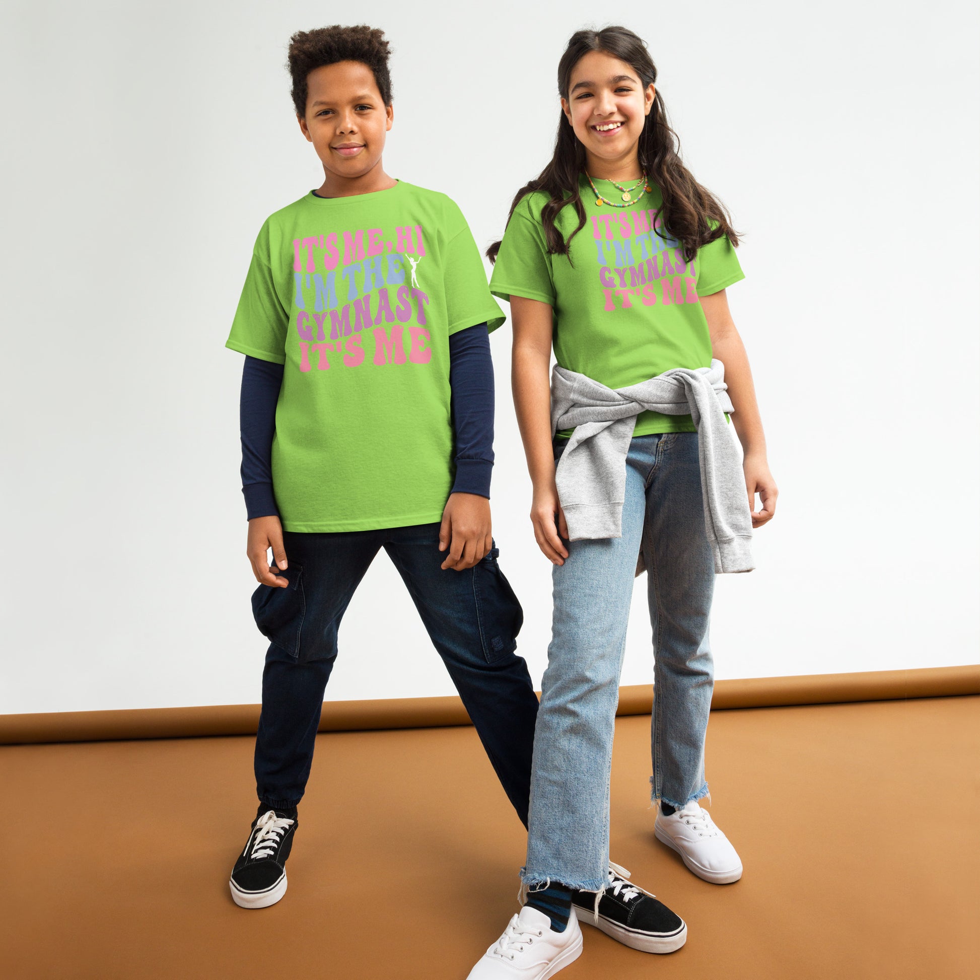 Kids gymnastics T-shirt, lime green, with pink “It’s Me Hi…Gymnast” text graphic
