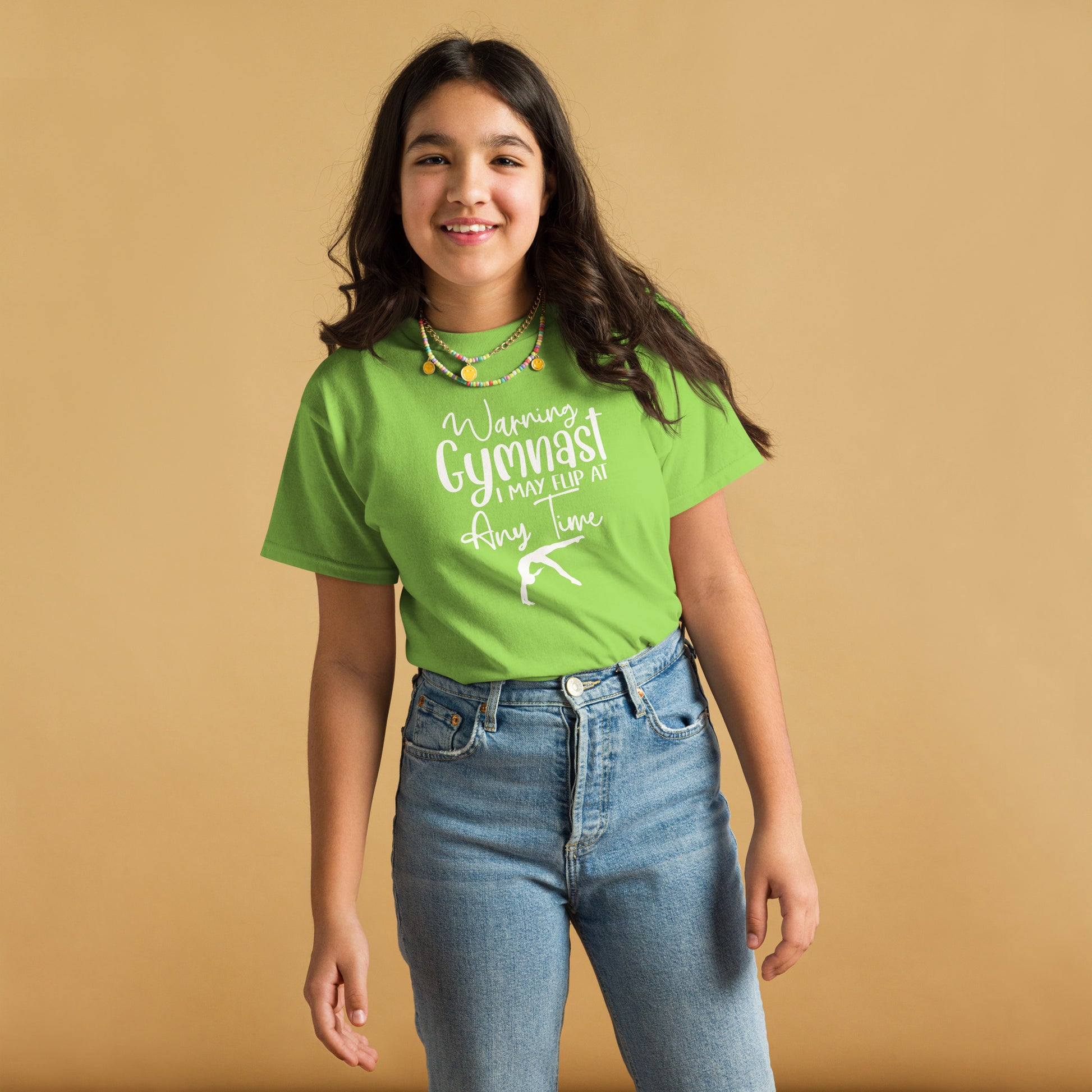Green kids gymnast T-shirt with white warning text and gymnast pose graphic on front