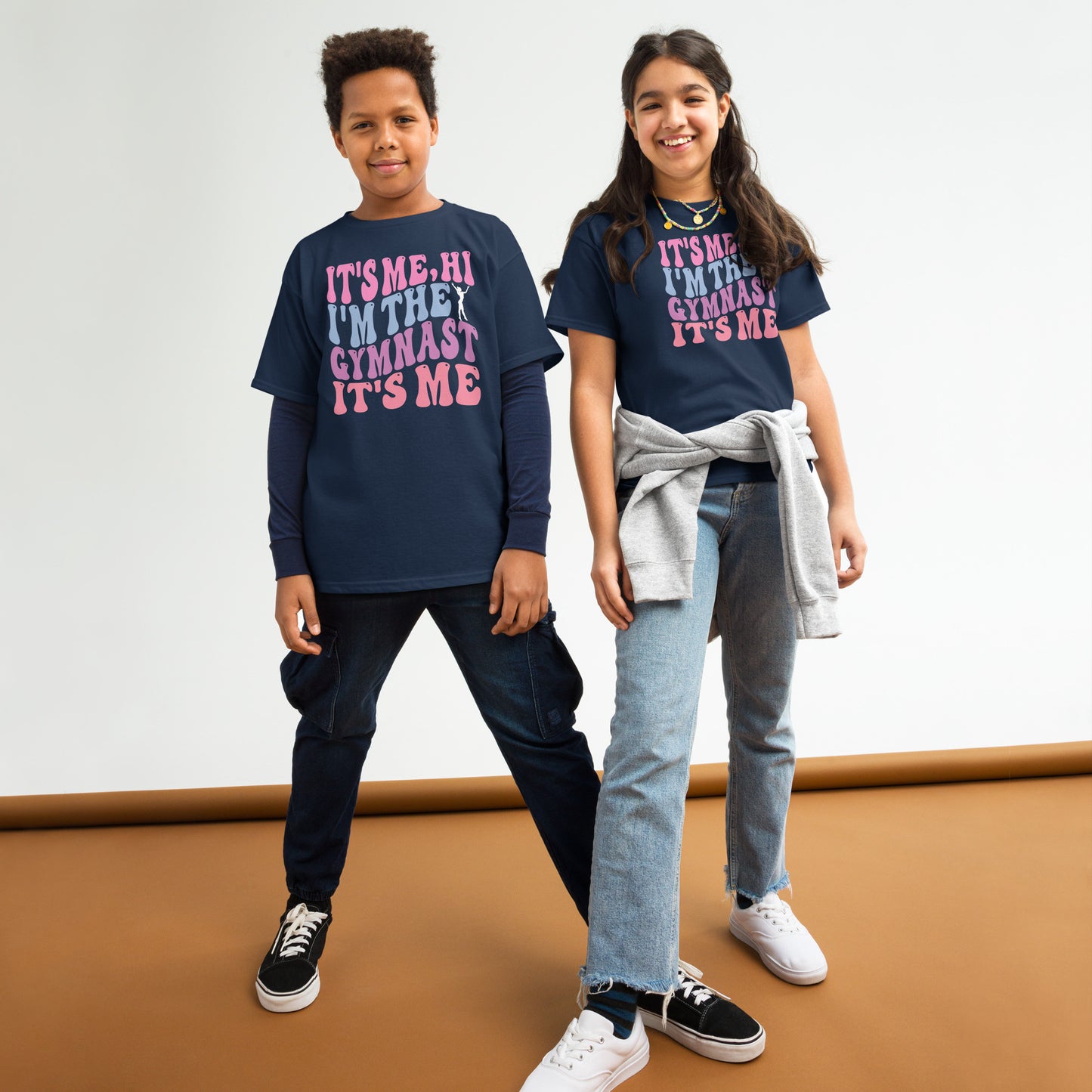 Kids gymnastics T-shirt, dark navy, with pink “It’s Me Hi…Gymnast” text graphic