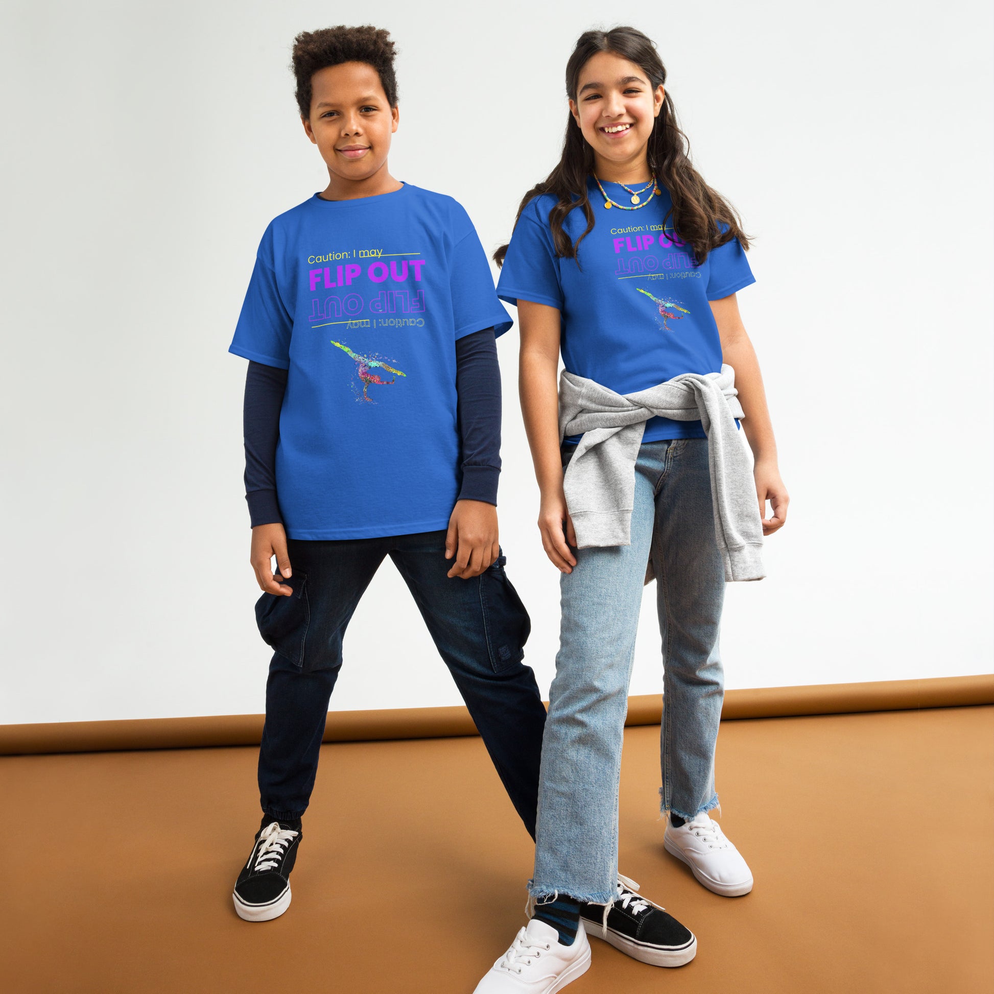 Kids gymnastics T-shirt, royal blue with “Flip Out” graphic and small gymnast logo at chest