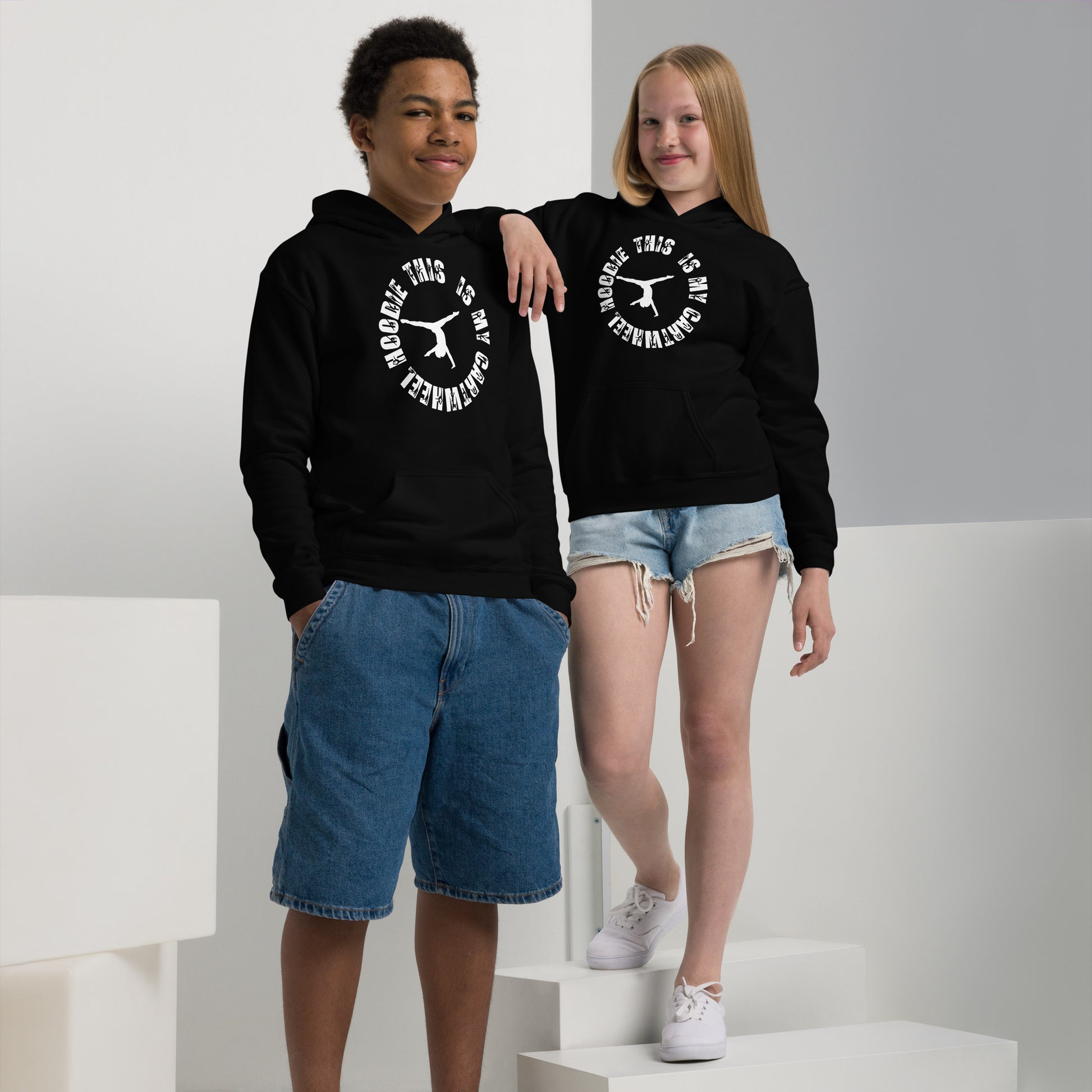 Kids black hoodies with white circular cartwheel logo, hoods and front kangaroo pockets