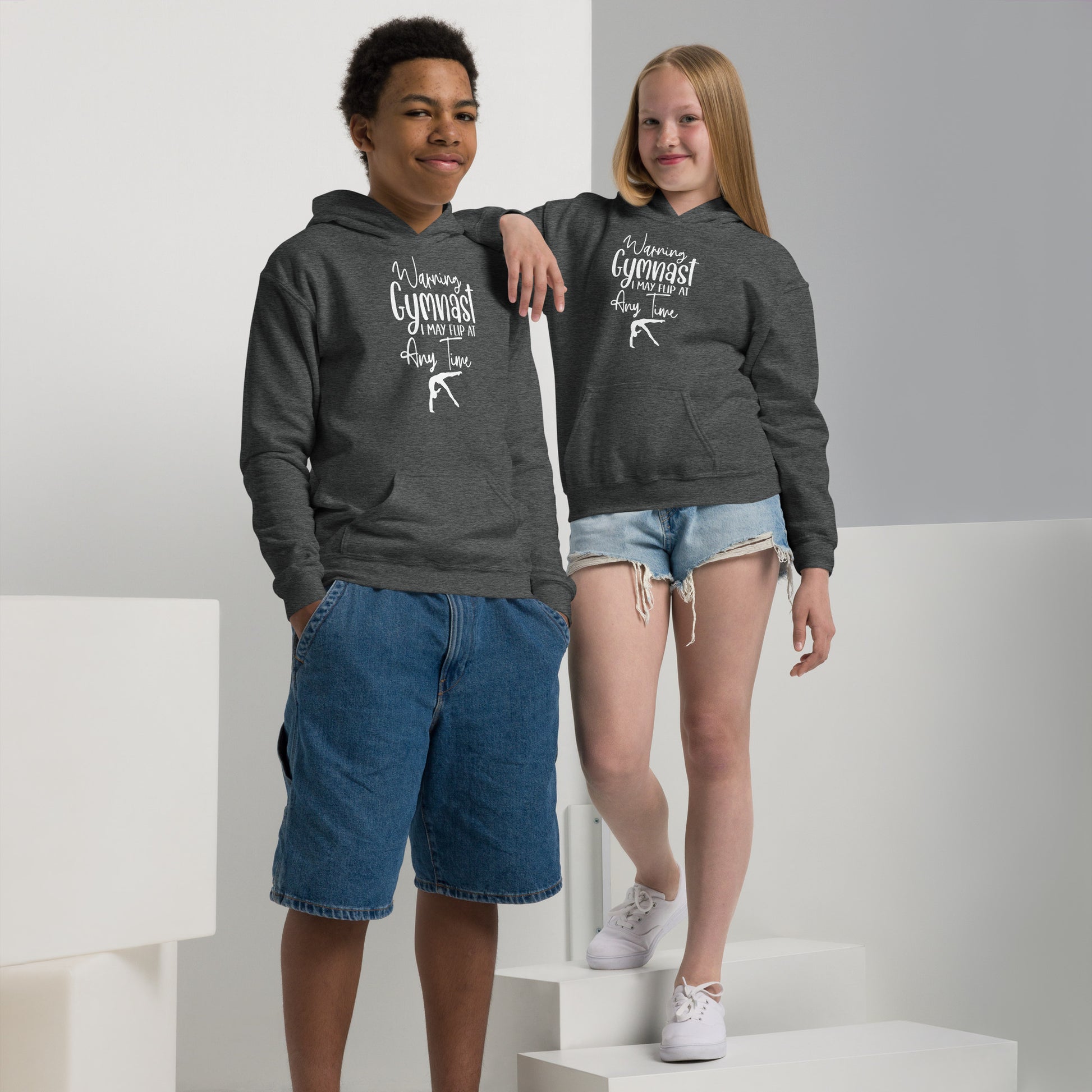 Kids dark heather gray hoodie with hood and kangaroo pocket, gymnast graphic on chest