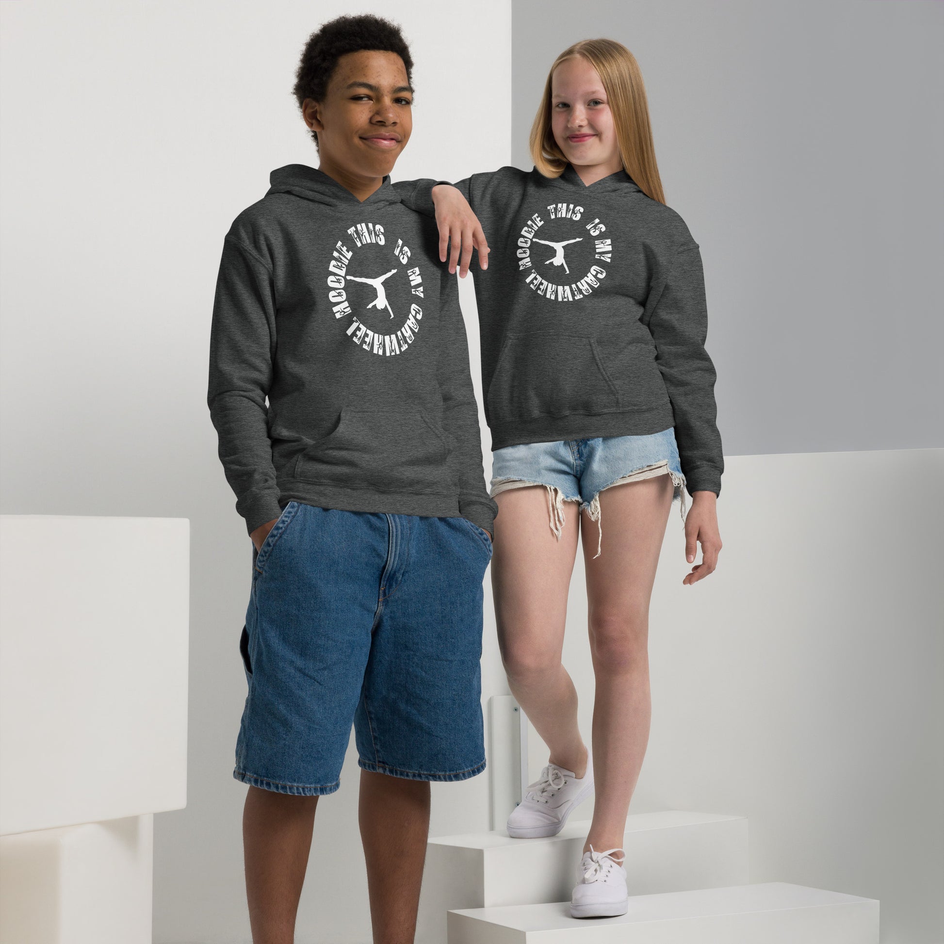 Kids gym hoodie in dark heather gray with hood and front kangaroo pocket, white logo graphic